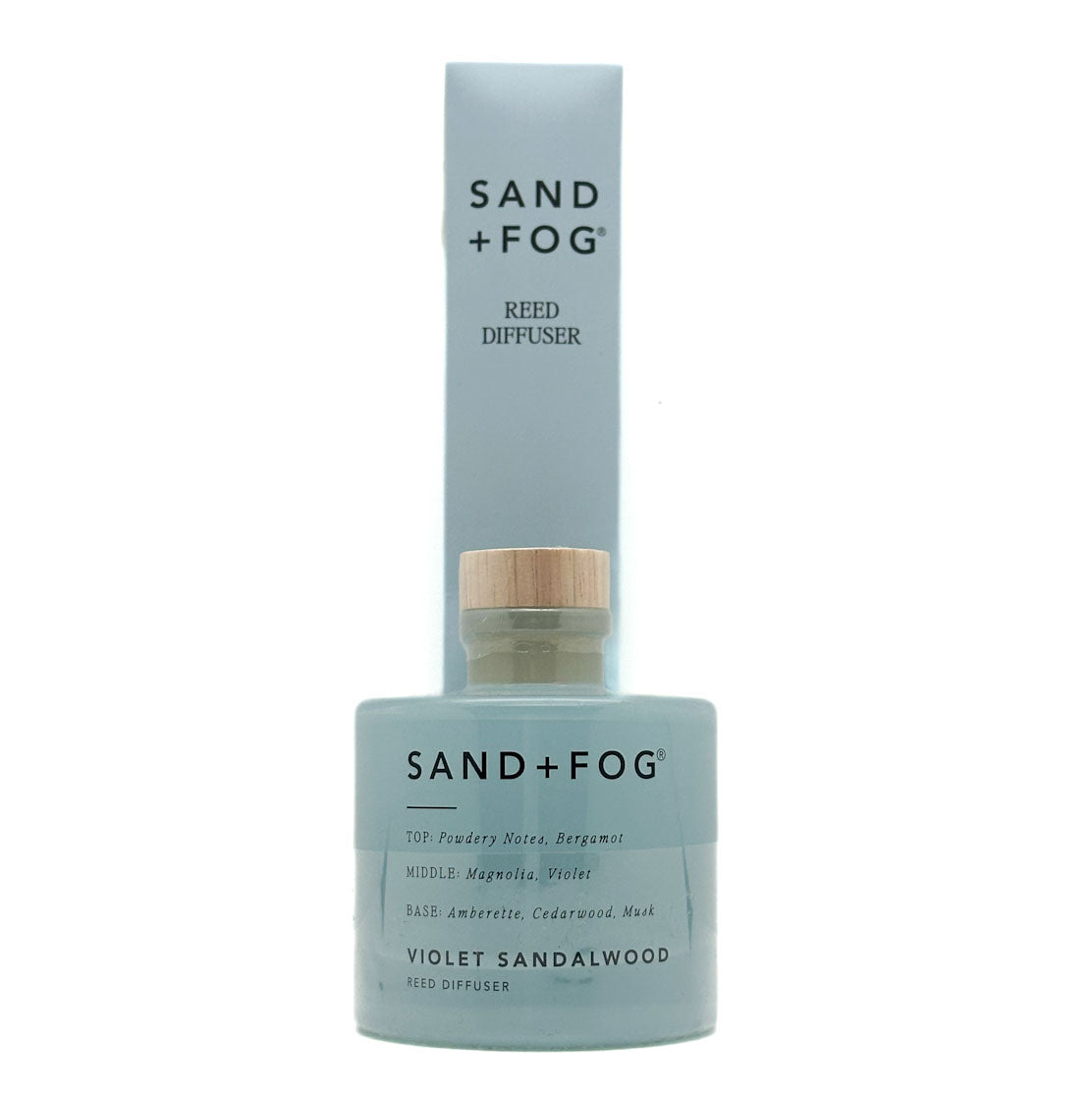 Sand + Fog Violet Sandalwood reed diffuser with blue bottle and white label on a white background