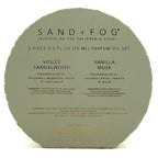 Sand + Fog 2-piece perfume oil set packaging with fragrance notes on a white background