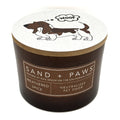 Weathered Spice Candle labeled 'Sand + Paws' with a dog illustration on a white background
