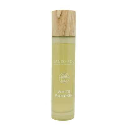 SAND + FOG room spray bottle labeled 'White Pumpkin' with a wooden cap on a white background