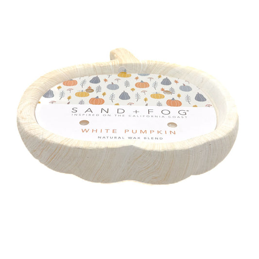 A pumpkin-shaped natural wax melt candle by Sand + Fog, labeled 'White Pumpkin' with a colorful pumpkin pattern on the label, set against a plain white background.