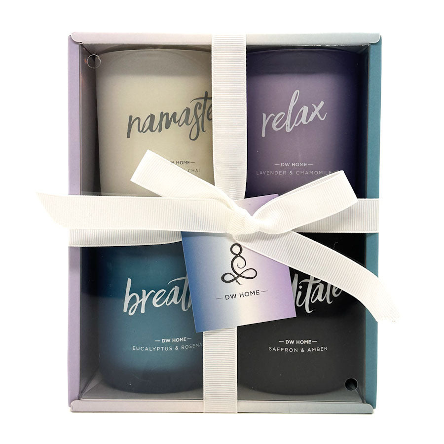 Set of four DW Home Zen Collection candles in a box with a white ribbon