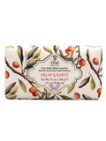 Zeni Argan & Karité Fine Triple Milled Soap Bar in a rectangular bar wrapper decorated with a botanical illustration of argan and karité tree branches with green leaves and orange fruits, on a white background.