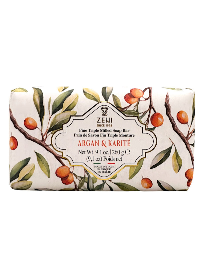 Zeni Argan & Karité Fine Triple Milled Soap Bar in a rectangular bar wrapper decorated with a botanical illustration of argan and karité tree branches with green leaves and orange fruits, on a white background.