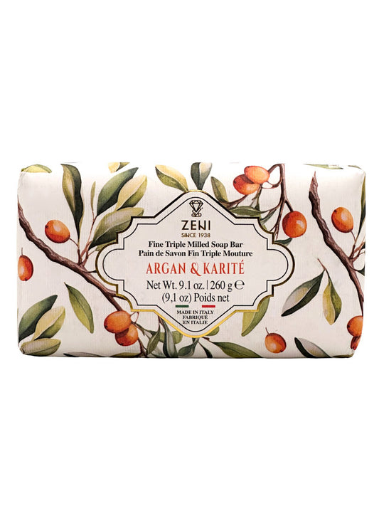 Zeni Argan & Karité Fine Triple Milled Soap Bar in a rectangular bar wrapper decorated with a botanical illustration of argan and karité tree branches with green leaves and orange fruits, on a white background.