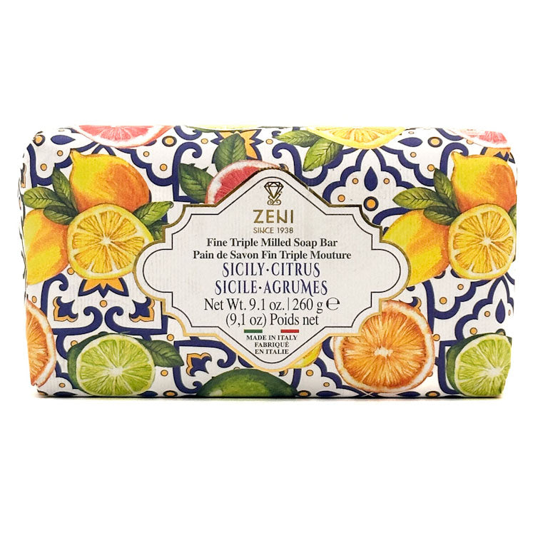 Zeni Sicily-Citrus fine triple milled soap bar wrapped in a white paper sleeve decorated with a blue pattern and illustrated with citrus fruits like oranges, lemons, and limes.