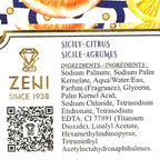Close-up of a product label showing the brand ZENI, scent name Sicily-Citrus Sicile-Agrumes, ingredients list, a QR code, and citrus slice illustrations at the top.